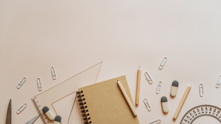 Spiral Notebook Pencils and Paper Clips Flatlay